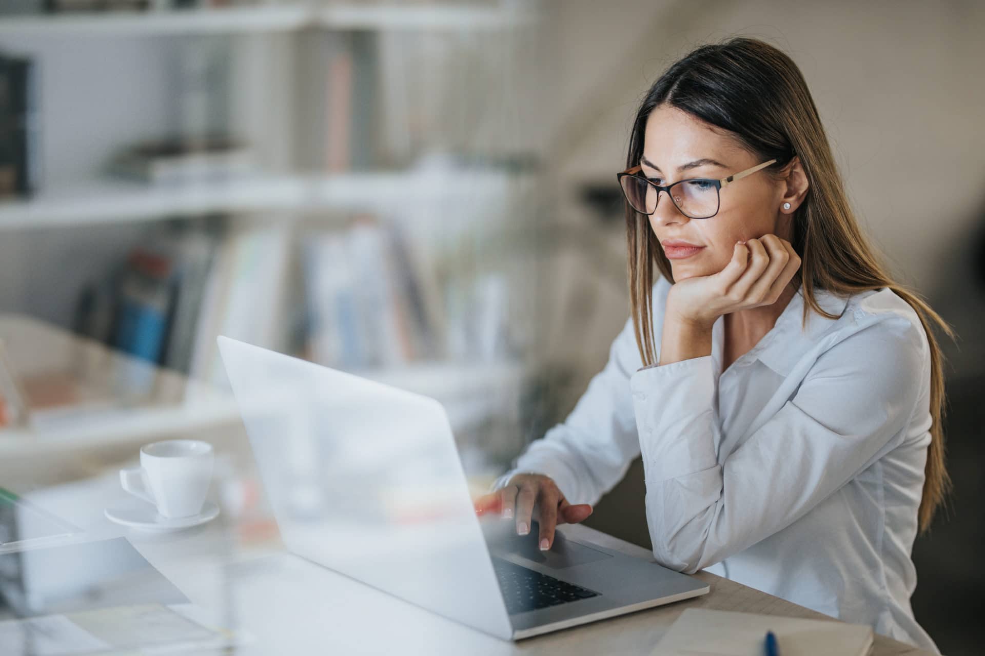 Businesswoman Working From Laptop With Managed IT Services