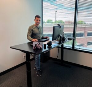 man standing table infiniwiz