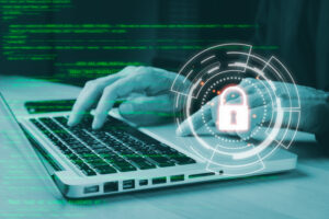 Hacker hand using keyboard typing bad data into laptop computer online system and spreading to global stolen personal information, fingerprint. phishing 