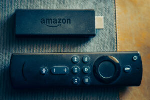 Amazon fire stick TV remote in hand